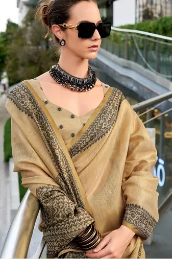 Women's beige silk blend woven  saree with unstitched silk blend blouse piece