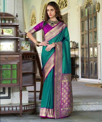 Women's dark green soft silk blend zari woven saree with unstitched silk blend blouse piece 1