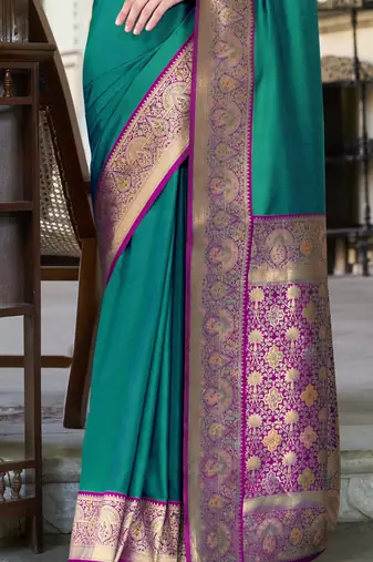 Women's dark green soft silk blend zari woven saree with unstitched silk blend blouse piece