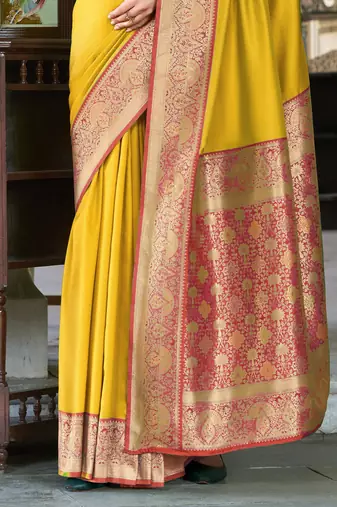 Women's yellow soft silk blend zari woven saree with unstitched silk blend blouse piece