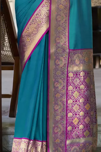 Women's teal soft silk blend zari woven saree with unstitched silk blend blouse piece