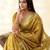 Women's mustard silk blend zari woven saree with unstitched silk blouse piece