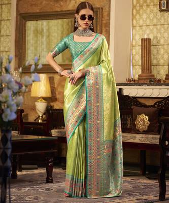Women's green tissue silk zari woven saree with unstitched silk blouse piece 1