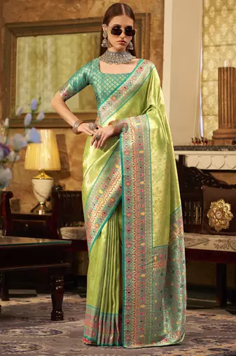 Women's green tissue silk zari woven saree with unstitched silk blouse piece
