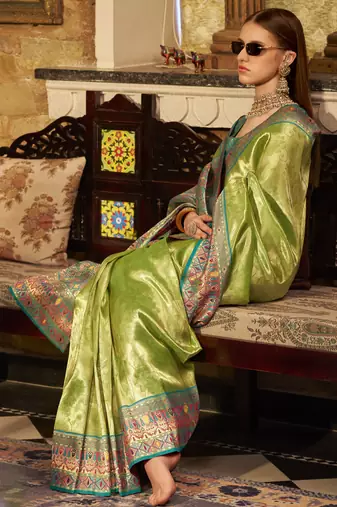 Women's green tissue silk zari woven saree with unstitched silk blouse piece
