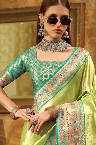 Women's green tissue silk zari woven saree with unstitched silk blouse piece