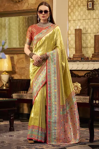 Women's yellow tissue silk zari woven saree with unstitched silk blouse piece
