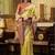 Women's yellow tissue silk zari woven saree with unstitched silk blouse piece