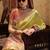 Women's yellow tissue silk zari woven saree with unstitched silk blouse piece