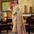 Women's beige tissue silk zari woven saree with unstitched silk blouse piece