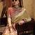 Women's beige tissue silk zari woven saree with unstitched silk blouse piece
