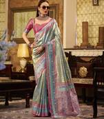 Women's turquoise tissue silk zari woven saree with unstitched silk blouse piece