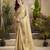 Women's beige tissue silk zari woven saree with unstitched silk blouse piece