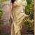 Women's beige tissue silk zari woven saree with unstitched silk blouse piece