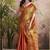 Women's rust tissue silk zari woven saree with unstitched silk blouse piece