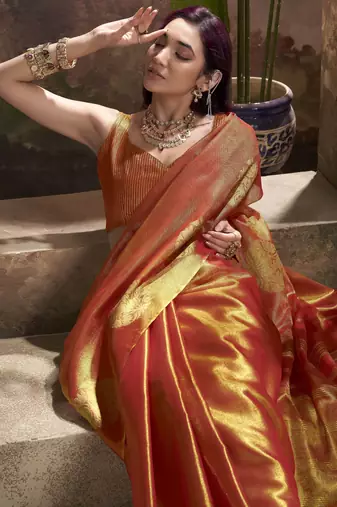 Women's rust tissue silk blend zari woven saree with unstitched silk blend blouse piece