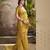 Women's gold tissue silk zari woven saree with unstitched silk blouse piece