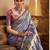 Women's blue tissue silk zari woven saree with unstitched silk blouse piece
