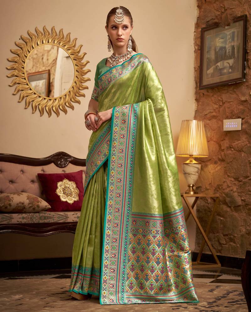Women's green tissue silk zari woven saree with unstitched silk blouse piece