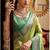 Women's green tissue silk zari woven saree with unstitched silk blouse piece