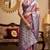 Women's pink tissue silk zari woven saree with unstitched silk blouse piece