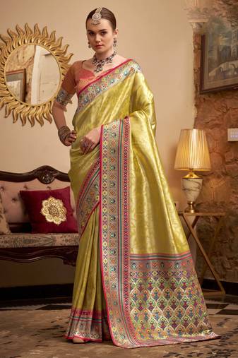 Women's yellow tissue silk zari woven saree with unstitched silk blouse piece