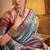 Women's turquoise tissue silk zari woven saree with unstitched silk blouse piece