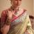 Women's beige tissue silk zari woven saree with unstitched silk blouse piece