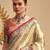 Women's beige tissue silk zari woven saree with unstitched silk blouse piece