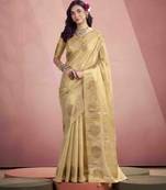 Women's beige tissue silk zari woven saree with unstitched silk blouse piece