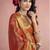 Women's rust tissue silk zari woven saree with unstitched silk blouse piece