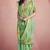 Women's sea green tissue silk zari woven saree with unstitched silk blouse piece