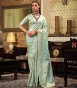 Women's turquoise satin banarasi silk saree with unstitched silk blouse piece