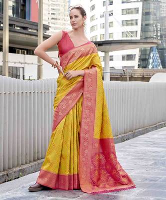 Women's yellow soft silk blend bandhani saree with unstitched silk blend blouse piece 1