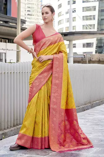 Women's yellow soft silk bandhani saree with unstitched silk blouse piece