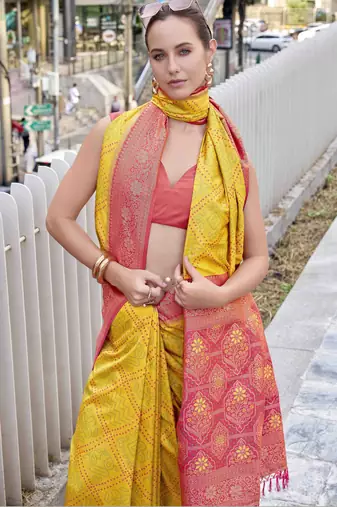 Women's yellow soft silk blend bandhani saree with unstitched silk blend blouse piece