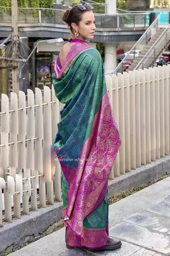Women's dark green soft silk blend bandhani saree with unstitched silk blend blouse piece