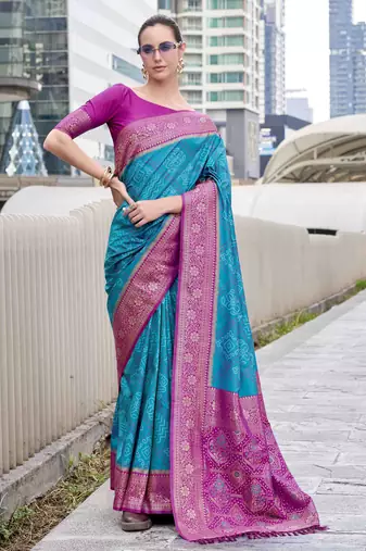 Women's teal soft silk bandhani saree with unstitched silk blouse piece