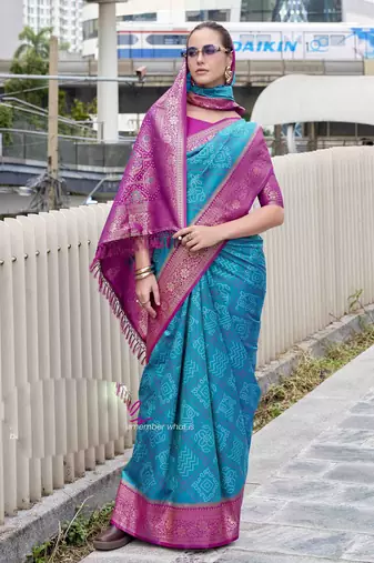Women's teal soft silk blend bandhani saree with unstitched silk blend blouse piece