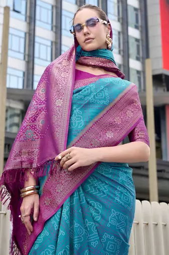 Women's teal soft silk blend bandhani saree with unstitched silk blend blouse piece