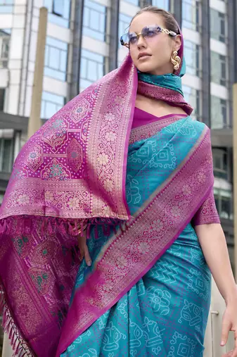 Women's teal soft silk blend bandhani saree with unstitched silk blend blouse piece