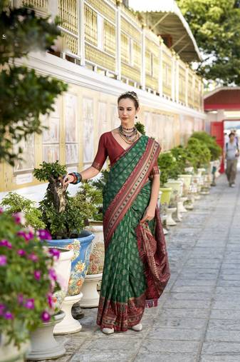 dark green soft ikat printed silk blend saree with unstitched blouse piece