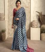 Women's blue satin crepe printed saree with unstitched silk blouse piece
