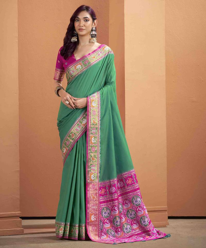 Women's dark green patola silk kalamkari saree with unstitched silk blouse piece