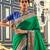 Women's dark green soft silk woven saree with unstitched silk blouse piece