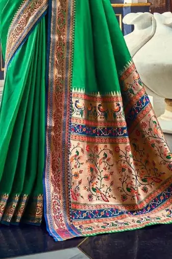 Women's dark green soft silk blend woven saree with unstitched silk blend blouse piece