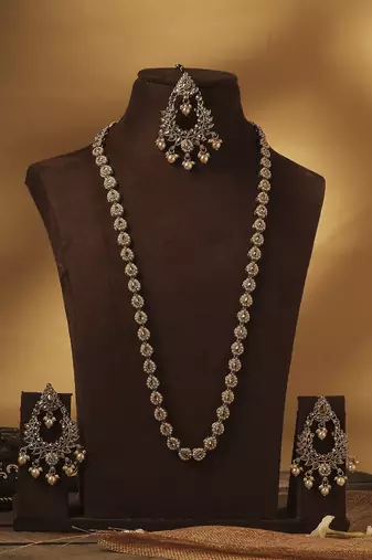 Paisley oval shape gold plated brown kundan stone long haram necklace set with maang tikka for women