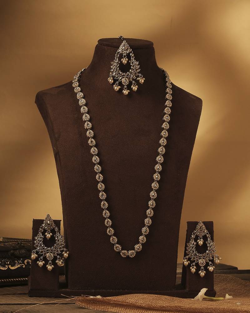 Paisley oval shape gold plated brown kundan stone long haram necklace set with maang tikka for women