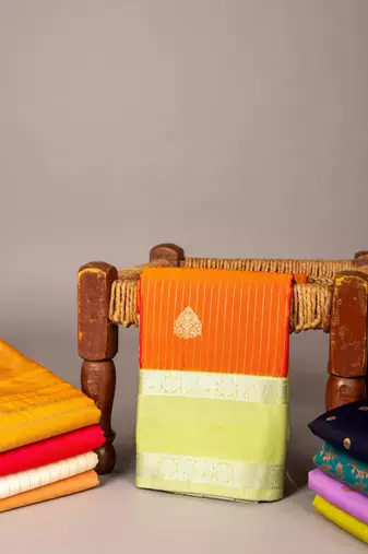 Golden orange and pastel green semi silk saree