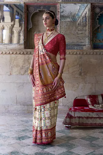 Silk blend cream and red patola print classic festival wear saree